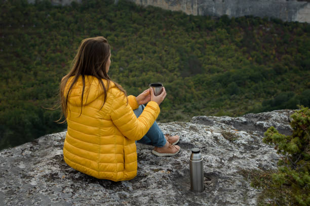 istock Young female traveler tea mountain. 1345976670