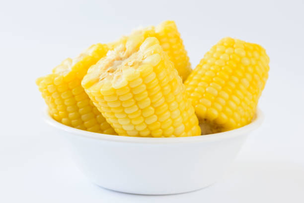 istock Pieces of boil corn in white bowl 1345978595