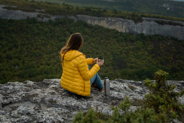 istock Young woman traveler tea mountain. 1345978980