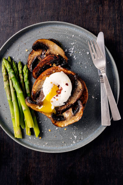 istock Portobello Mushrooms With Poached Egg and Asparagus 1345979094