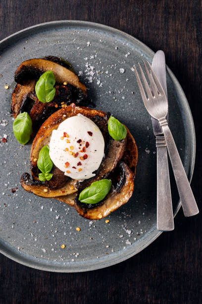 istock Portobello Mushrooms With Poached Egg 1345979317