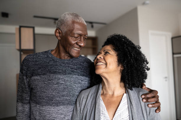 istock Happpy senior couple looking at each other at home 1345979906