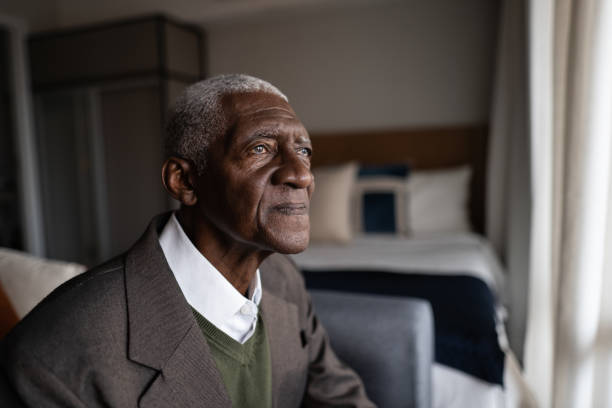 Contemplative senior man at home Contemplative senior man at home alzheimer patient stock pictures, royalty-free photos & images