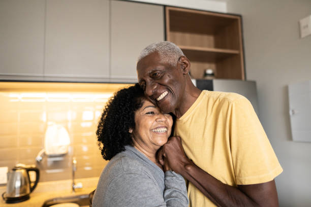 istock Senior couple embracing each other at home 1345980199