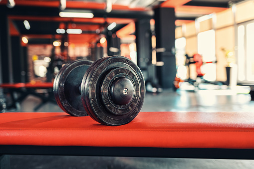 Dumbbells close-up in the gym. Low angle vew. Copy space.