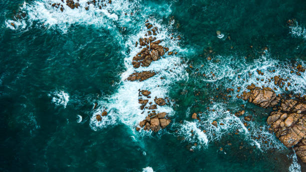 istock Aerial view over the mediterane ocean water at the steep cliffs 1345981824
