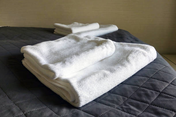 istock On the bed are clean white towels, hotel room. 1345982017