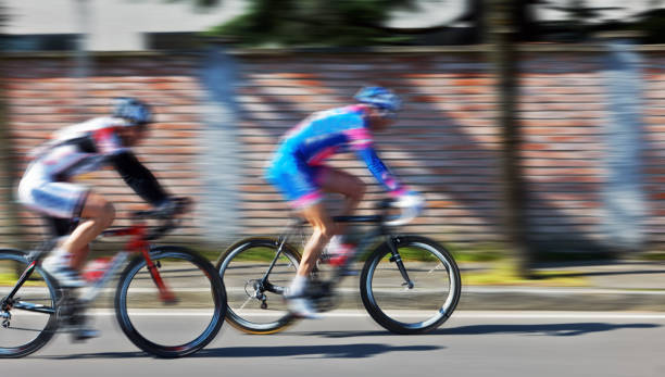 istock cyclists run on the city street 1345982899