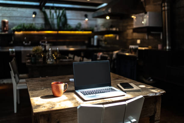 istock A laptop on top of a dining table at home 1345985519