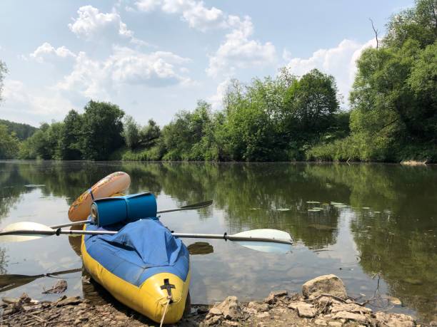 istock Kayak on the river bank 1345985722