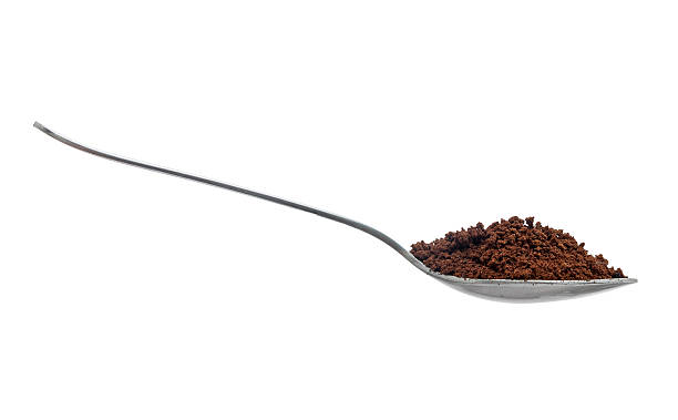 istock Spoonful of instant coffee granules, isolated over white backgroud 134598608