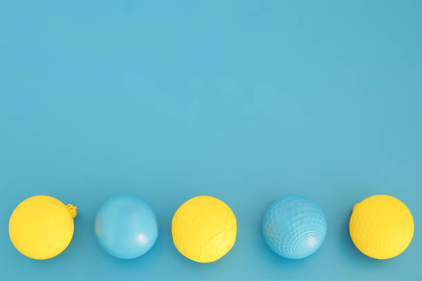 istock Blue and yellow Christmas composition. Trendy Xmas background, mockup. Modern design. Free space for text, copy space. Flat lay, top view 1345986355