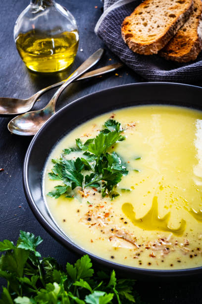 istock Creamy zucchini soup on wooden table 1345986653