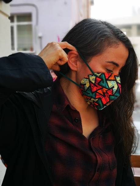 istock Woman wearing protective face mask 1345988627