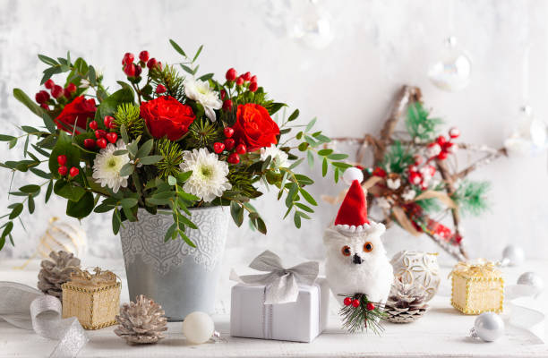 istock Christmas flower composition for holiday. 1345989124