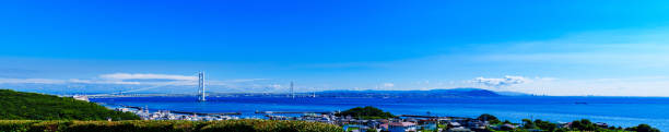 akashi kaikyo brücke in kobe japan - kobe bridge japan suspension bridge stock-fotos und bilder