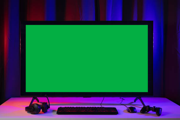 istock Blank screen display computer pc with gaming gear joystick mouse keyboard mouse. Gamer gadget background in game station. 1345997925