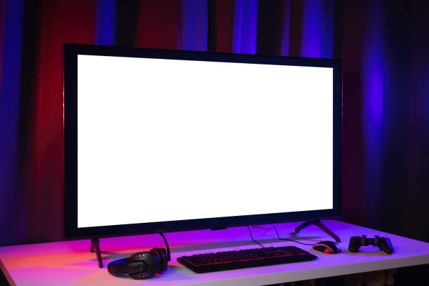 istock Blank screen display computer pc with gaming gear joystick mouse keyboard mouse. Gamer gadget background in game station. 1345997926