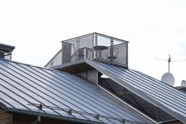 Unique place balcony with chairs and table on rooftop. Photo taken on a warm summer overcast day with many clouds in sky.