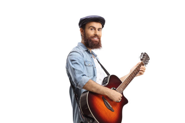 istock Bearded guy playing an acoustic guitar 1345998884