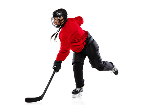 Stickhandling. Portrait of professional female hockey player training isolated over white background. Match, competition preparation. Concept of sport, action, movement, health. Copy space for ad