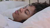 Close up pf Peaceful African Woman Sleeping in Bed