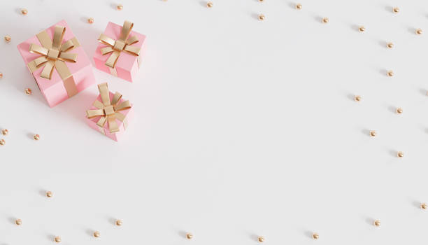 istock Pink gift boxes with golden ribbon on white background, 3d render 1346006446