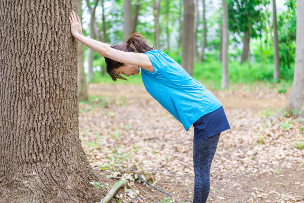istock A young woman stretching in the nature 1346007762