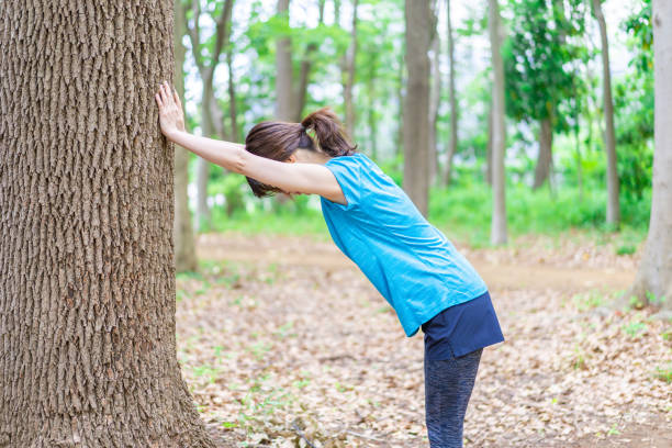 istock A young woman stretching in the nature 1346007775