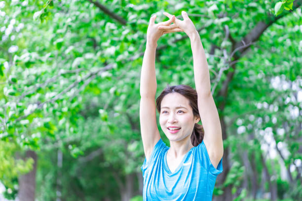 istock A young woman stretching in the nature 1346007803