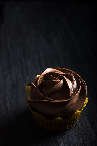 Concept for a sweet snack, sweet dessert on dark background with space for text above.  Selective focus. Close up.