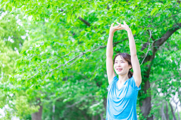 istock A young woman stretching in the nature 1346007821
