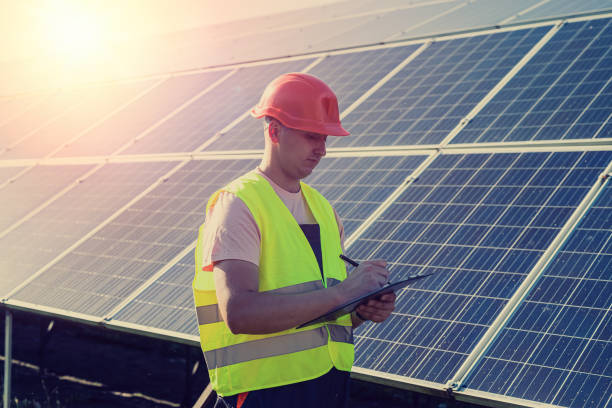 istock young caucasian man in uniform works at a solar station 1346010005