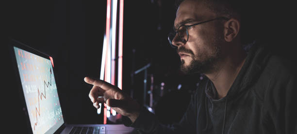 istock A man analyzing stock market charts, financial data on an electronic board. 1346010730