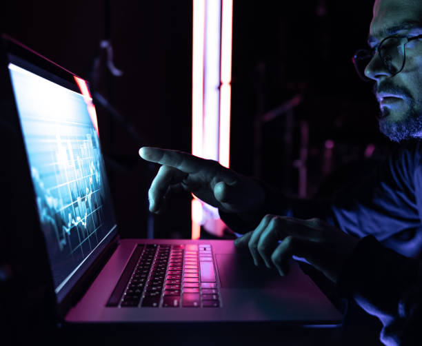 istock A man analyzing stock market charts, financial data on an electronic board. 1346010740