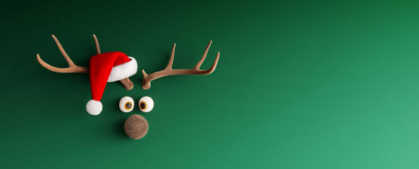 reindeer with santa hat on green mock up christmas background - reindeer imagens e fotografias de stock