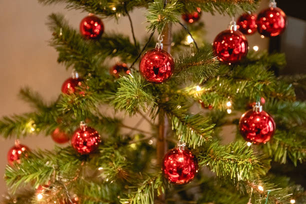istock Christmas tree decorations background for design template. Bright glowing lights, New year concept, toys and balls on the spruce tree 1346012081