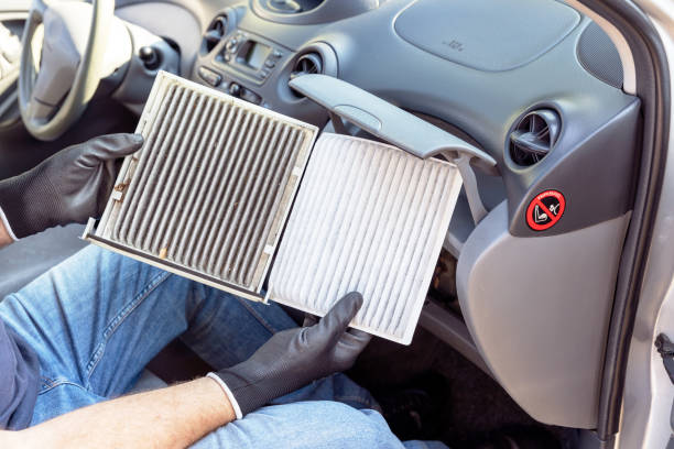 istock Replacing the dirty cabin pollen air filter for a car 1346013271
