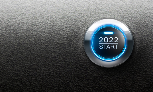 Blue start 2022 button on black leather background with copy space