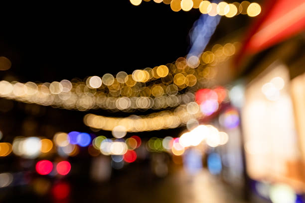 istock Abstract Christmas tree blurred defocused background for design concept template. Bright glowing lights, New year decoration 1346013952