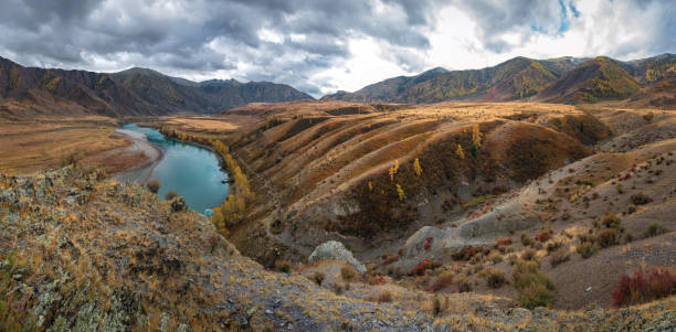 istock mountains river hills trees autumn clouds 1346014747