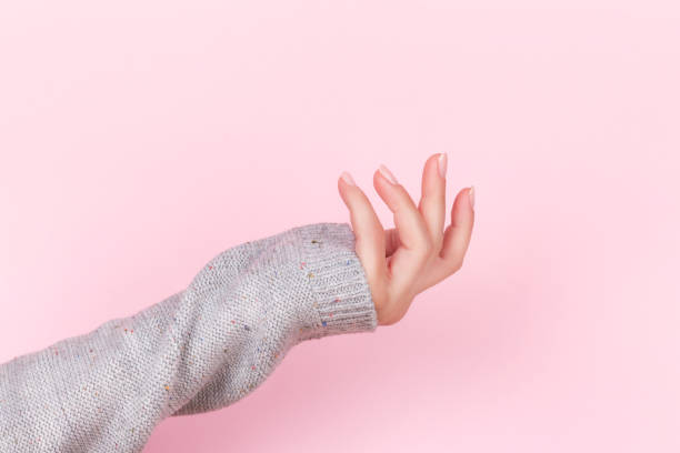 istock Female hand with nude nails 1346014932