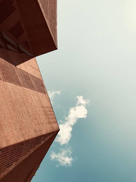 Completed 2013, by O’Donnell + Tuomey Architects. The building is designed to embody the dynamic character of a contemporary Student Union. The complex geometries of the site provided a starting point for an unconventional arrangement of irregular floor plates, each one particular to its function and each working into the next by an intricate system of trapezoidal spatial configuration.