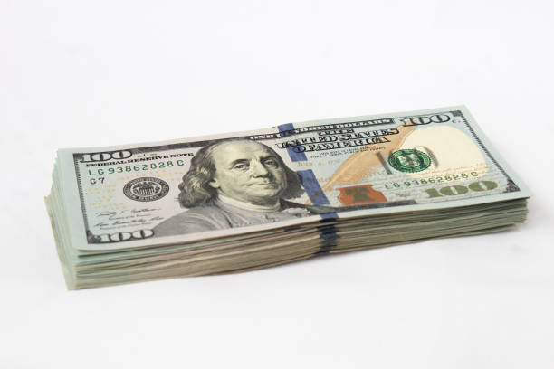 istock A stack of hundred-dollar bills on a white isolated background. 100 dollar bills 1346016334