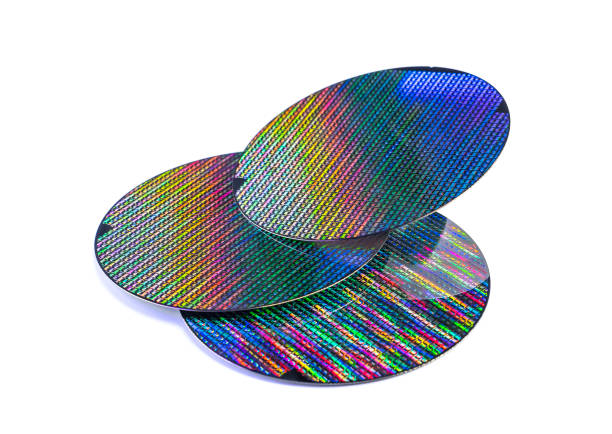 Silicon wafer with chips isolated on white background Silicon wafer with chips isolated on white background computer wafer stock pictures, royalty-free photos & images