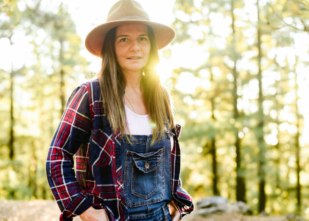 istock Content traveler standing in woods in autumn 1346019741