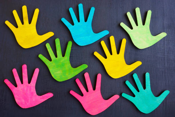 istock Multi-colored palms as a symbol of diversity. 1346022491