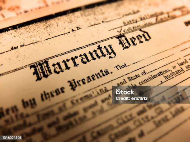 Old Warranty Deed Transfer Title To Land Real Property Home Legal Document Stock Photo - Download Image Now