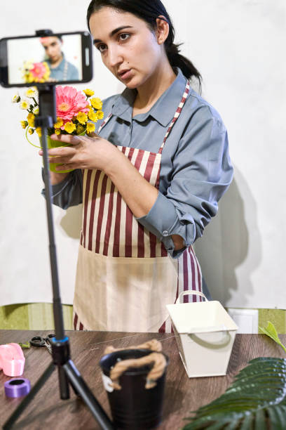 istock Multiracial florist blogger live streaming online 1346025111