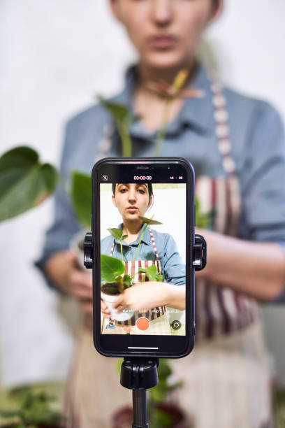 istock Multiracial florist blogger live streaming online 1346026331